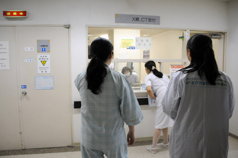 Chinese tourist Zhang Lan, left, awaits X-rays during her check-up at a hospital in Asahikawa, in Hokkaido prefecture, Japan, on June 13, 2012. (Toshifumi Kitamura/AFP/Getty Images)